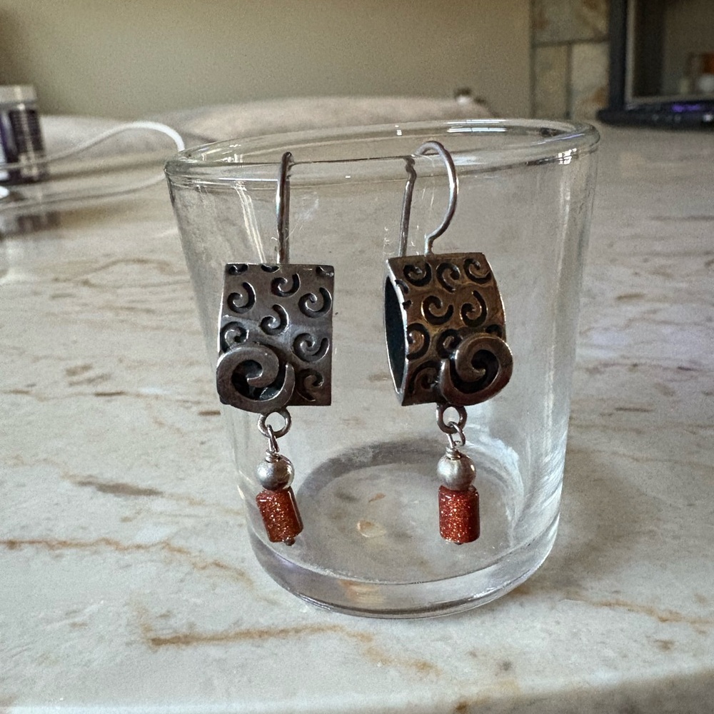 Elegant Swirl Earrings with Red Accents